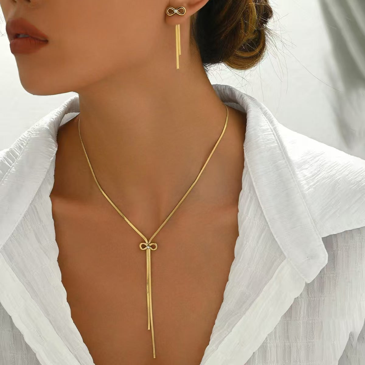 Stainless Steel Bow Design Necklace And Earrings Suite