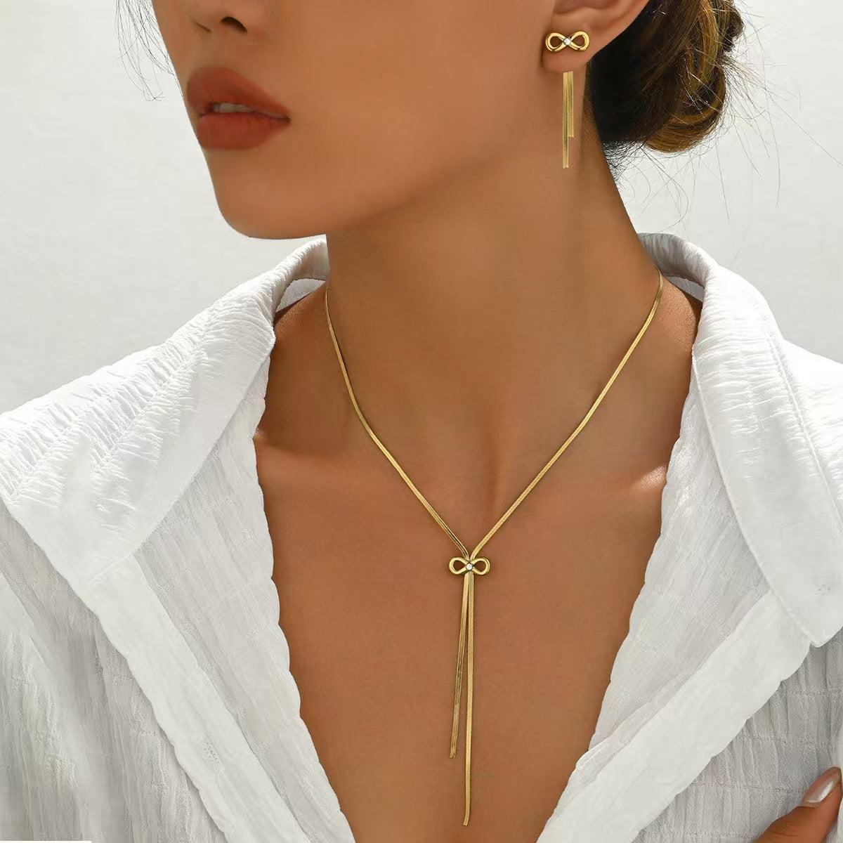 Stainless Steel Bow Design Necklace And Earrings Suite